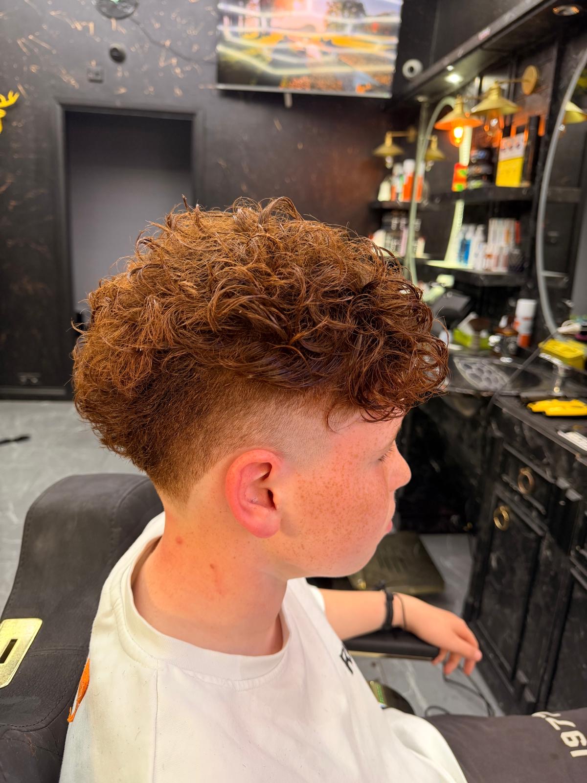 Natural copper curls with tight skin fade