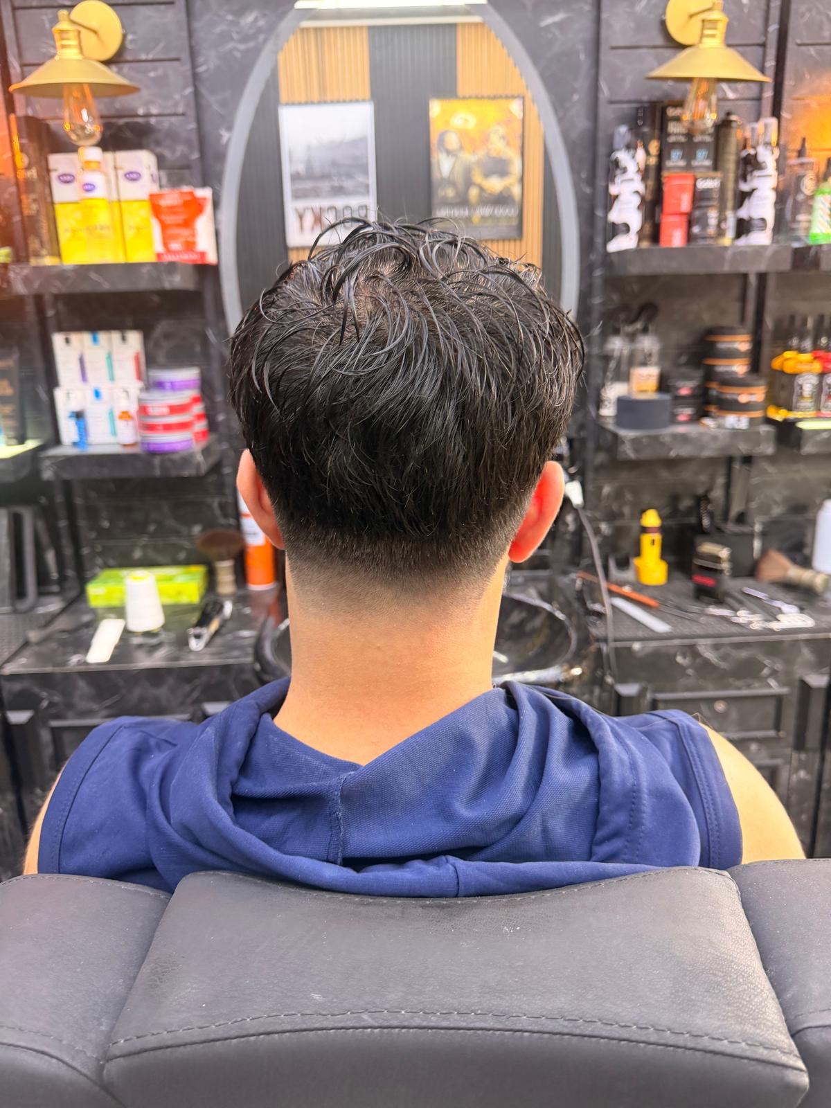 Textured top with clean low taper fade from the back